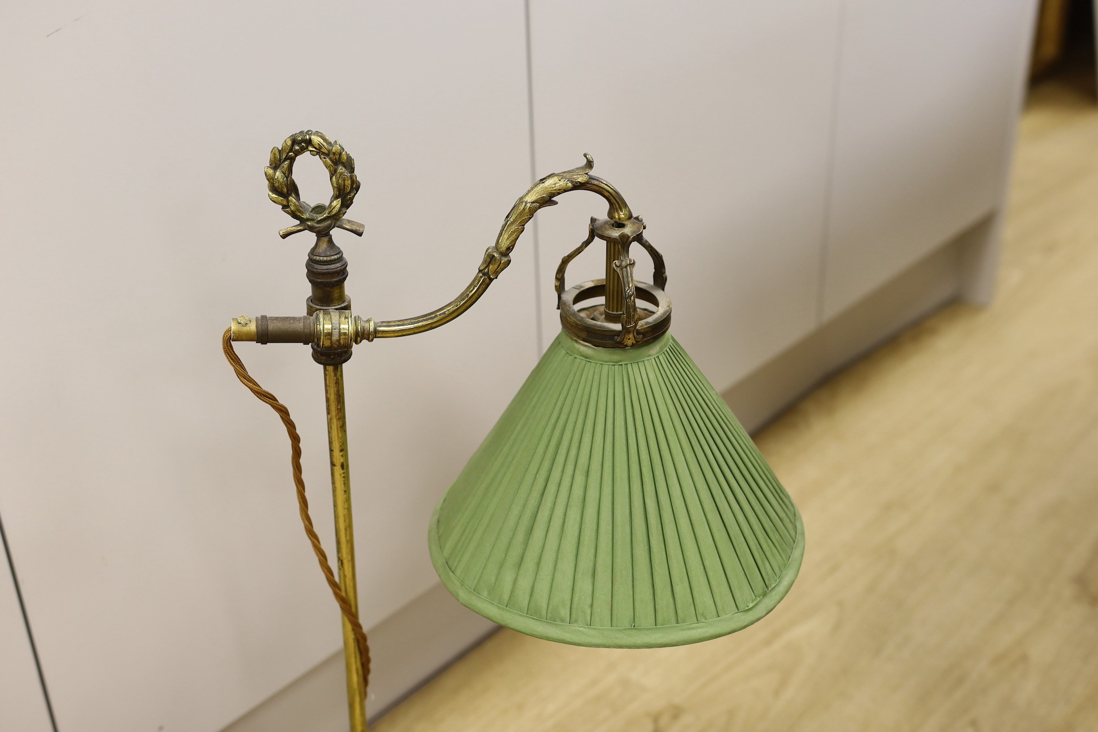 A pair of Louis XVI style gilt brass reading lamps, 66cm